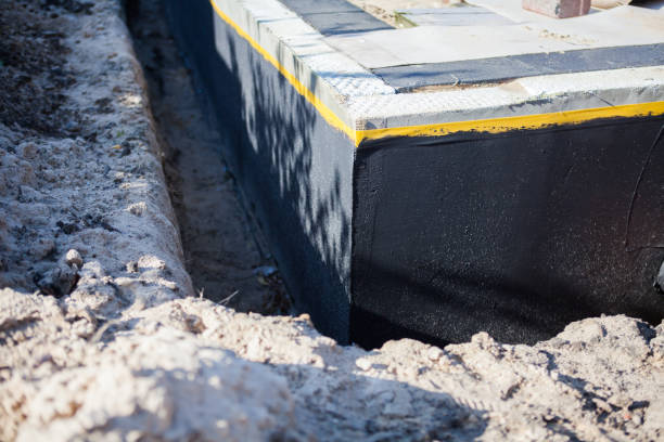 Professional Waterproofing technician working in Lyons, IN